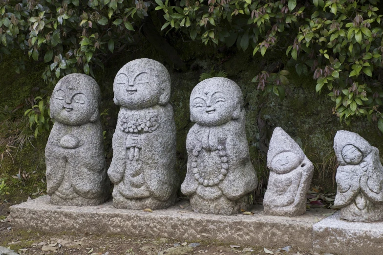 stone statues have faces with different expressions