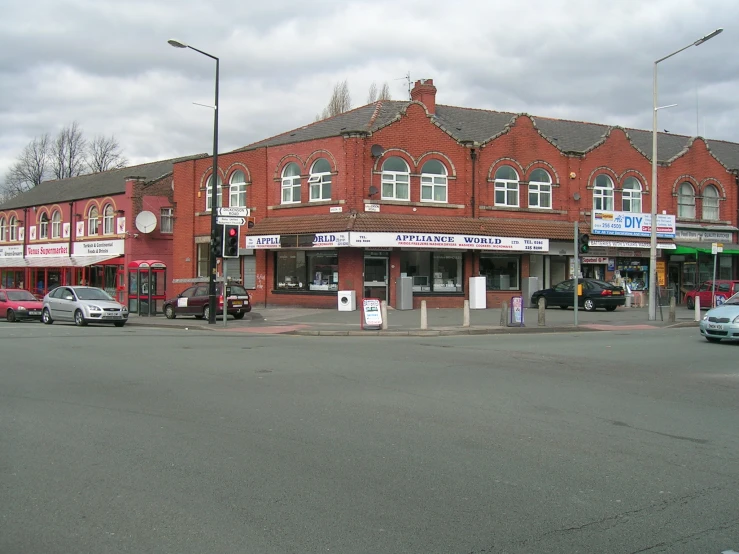 a large red brick building with an outside store front