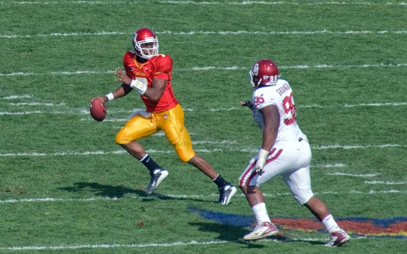 a man is running the ball on a field