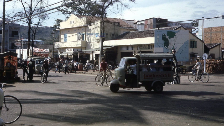 a car driving down the street in front of a building