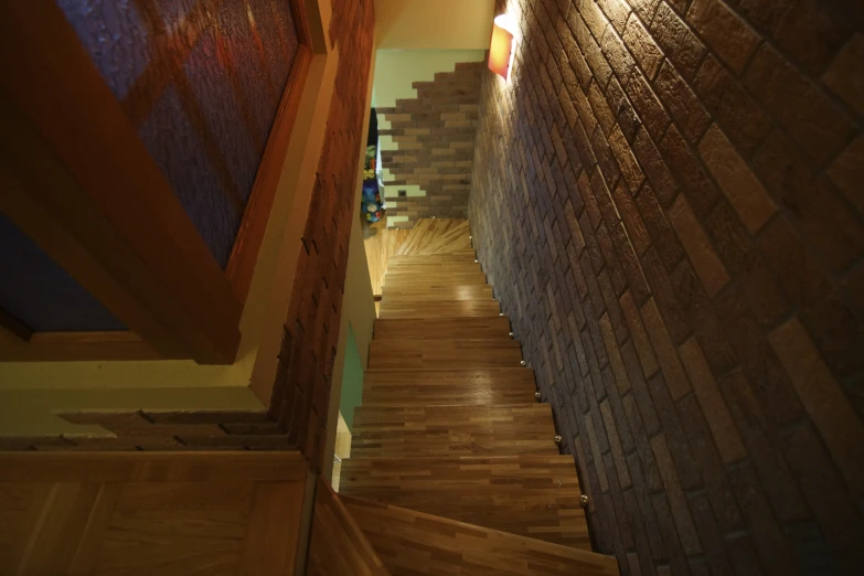 an upturned view of a wood floor and stairwell