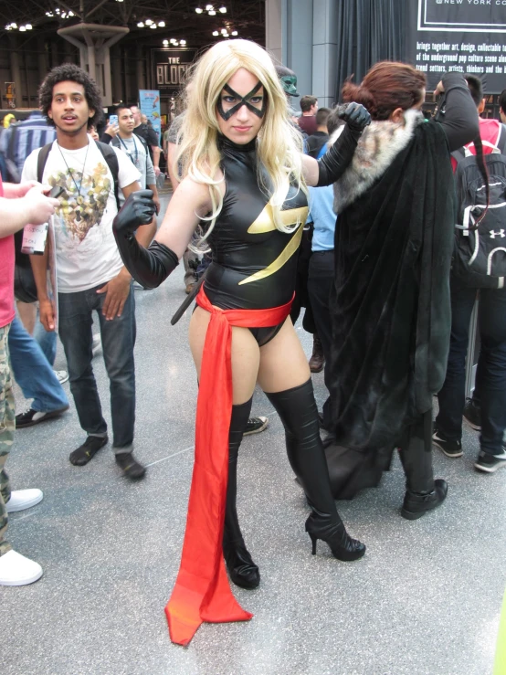 woman dressed up in cosplay clothing at a convention