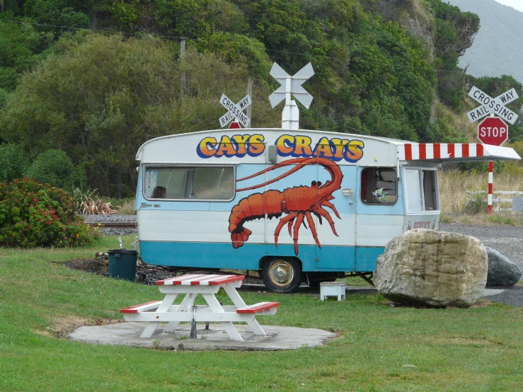the crab house is located next to an old - fashioned camper