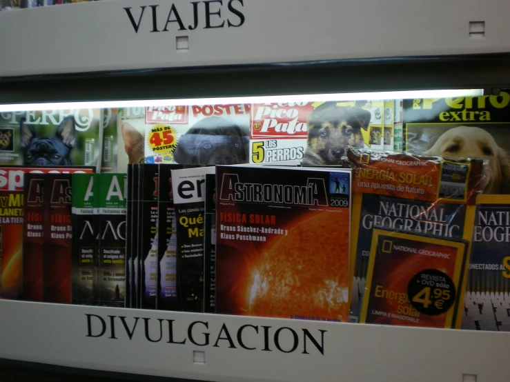 a bunch of books in front of each other on a shelf