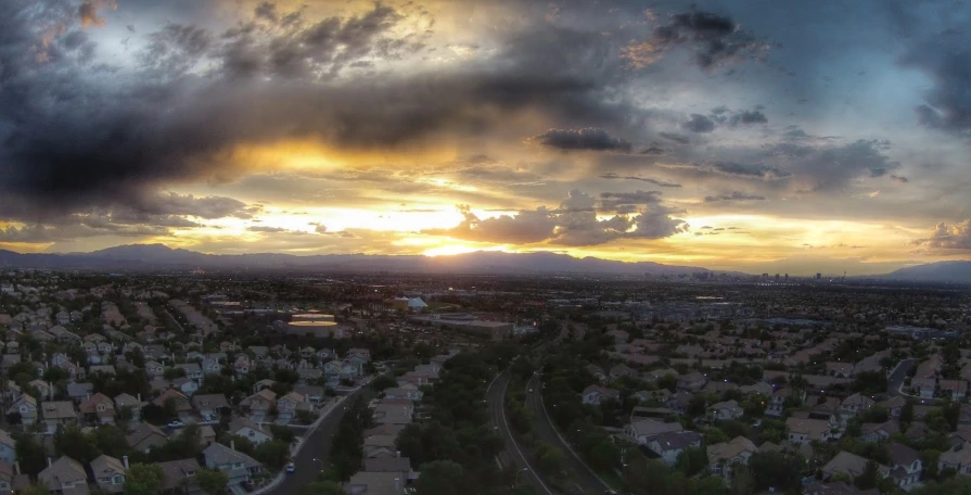 sunset over suburbs in small town area with homes