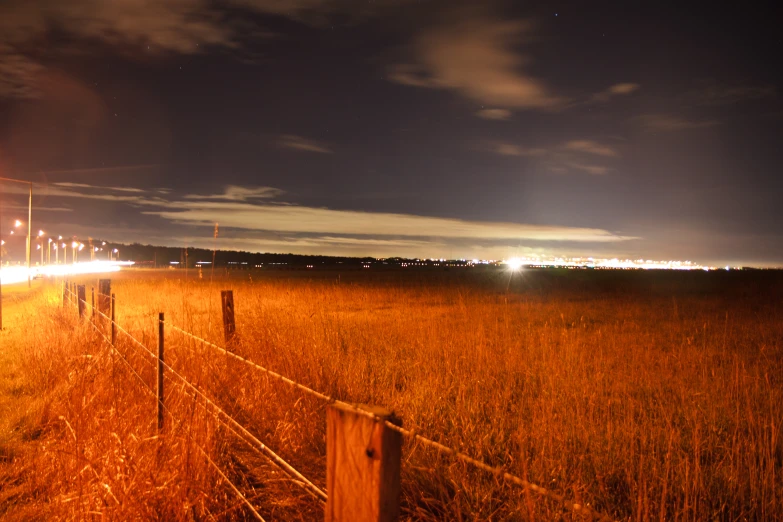 long lines of cars driving down the highway at night