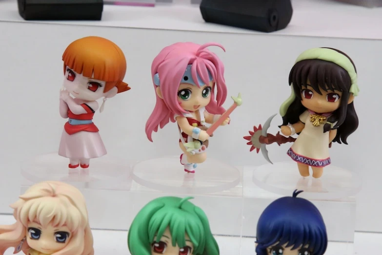 some figurines that are on a stand