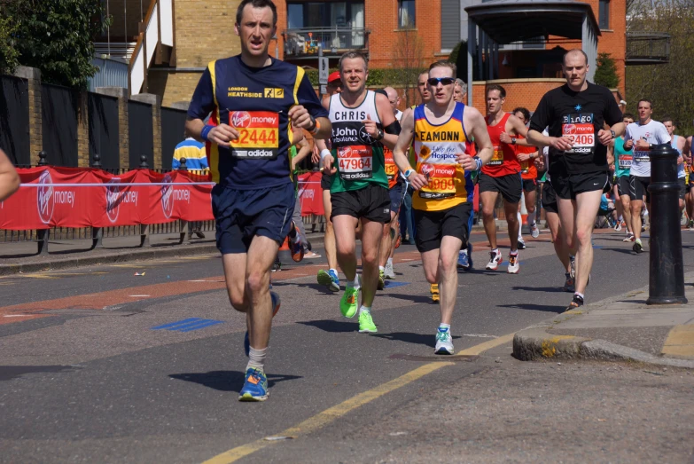 a group of people that are running in the road