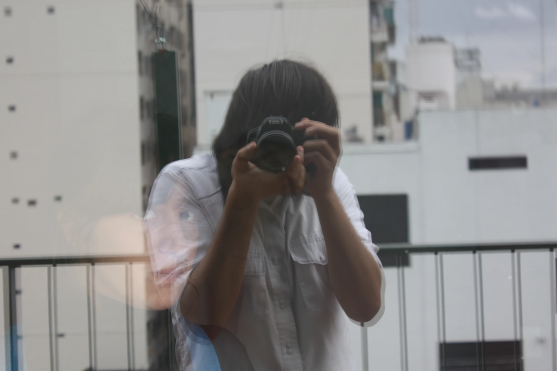 a woman taking a picture of herself in the mirror