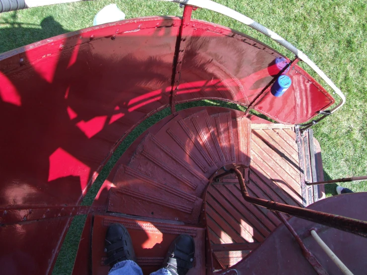 the top of a spiral staircase on grass