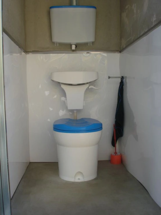 a small bathroom with blue and white fixtures