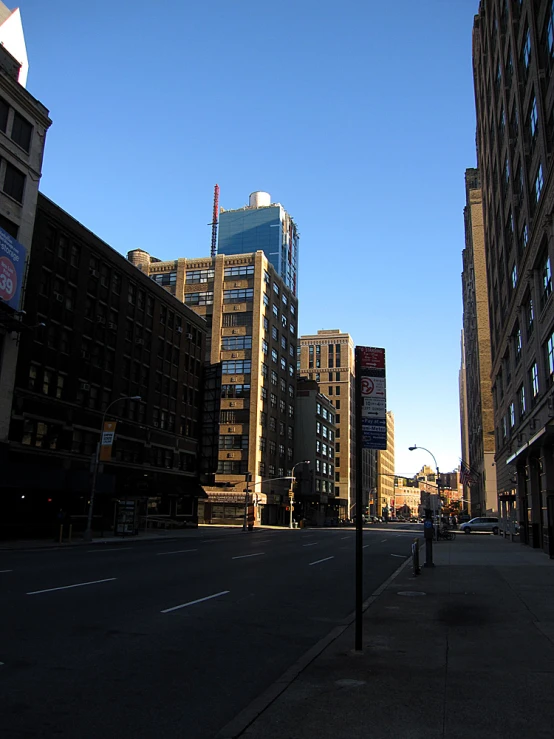 a street and some tall buildings in a city