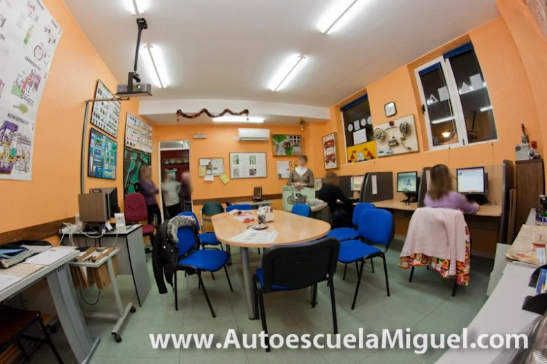 several people sitting around an office meeting room