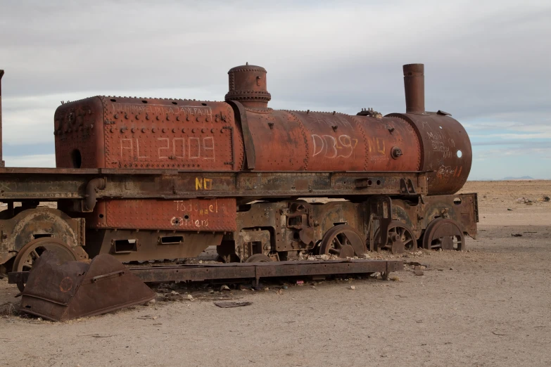 rusted out abandoned train in empty terrain