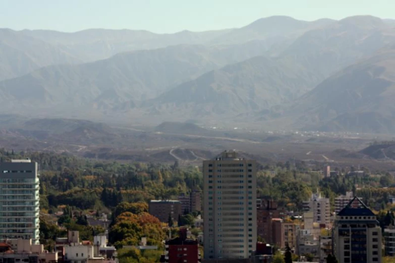 a city with mountains in the background