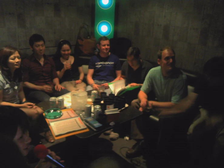 a group of people sitting around a table