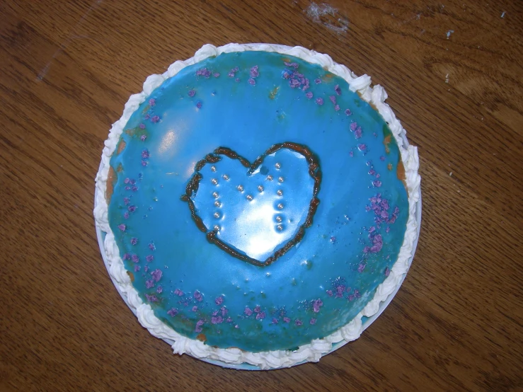 the cake has been decorated with blue icing
