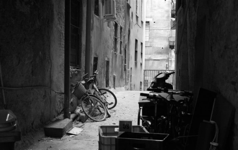 a bike leans on a street next to the walls