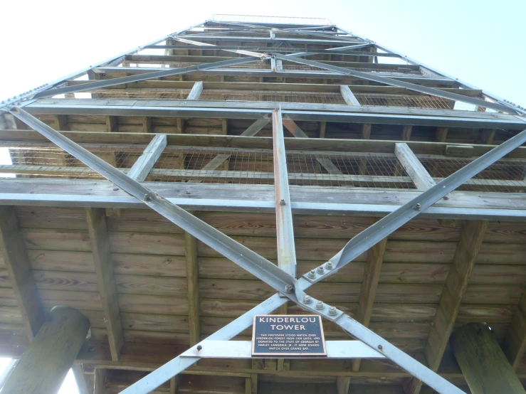 the top of an old wooden structure with a metal roof