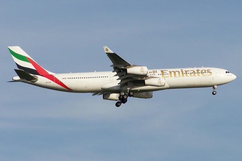 a large jet airplane flying in the sky