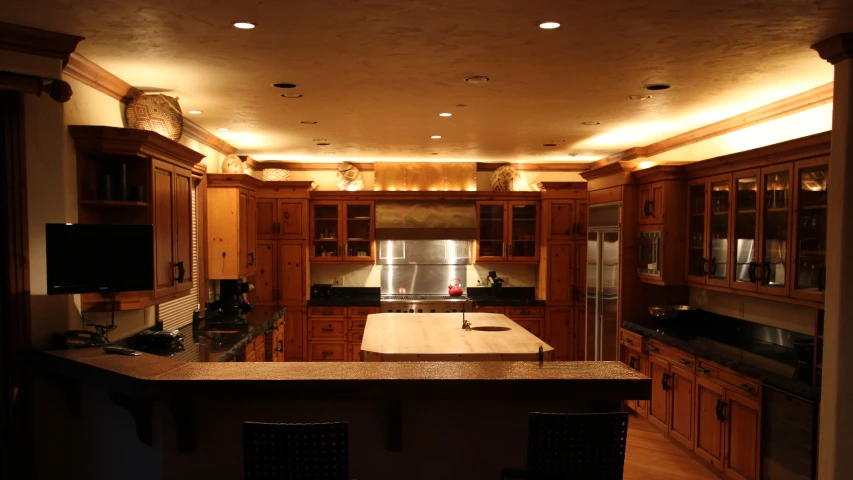 an interior view of a kitchen with lights on