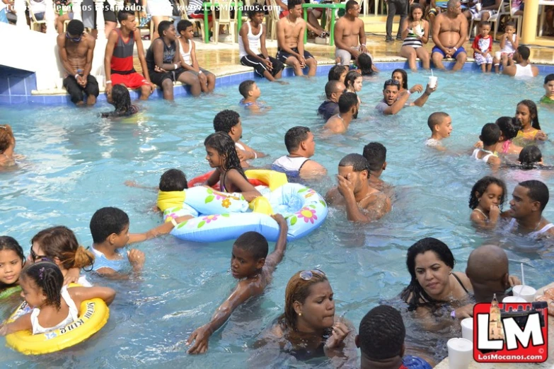 an overview of people and the pool area at a el