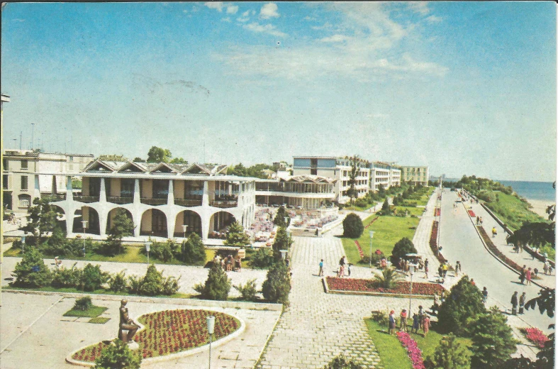 a vintage picture of an empty courtyard with several buildings