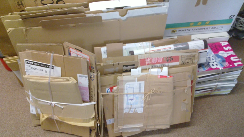 the boxes are stacked up on the carpet