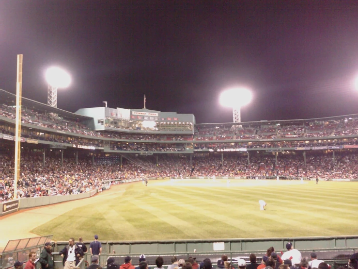 a professional baseball game is being played in the night time