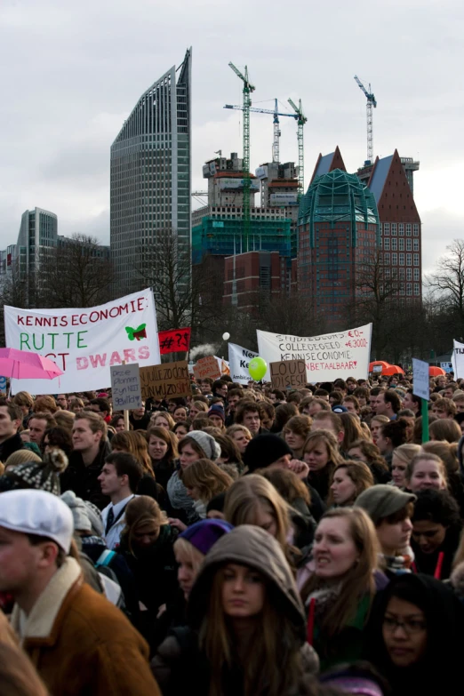 an outdoor protest against climate change in front of the nyc skyline