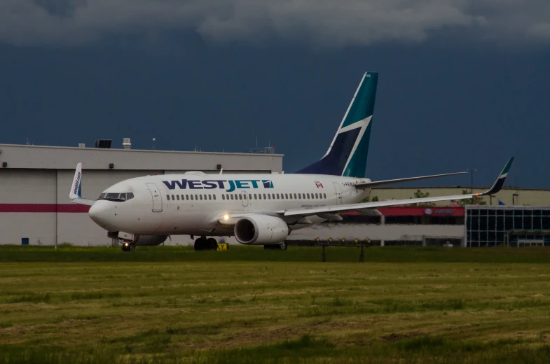 a large passenger jet sitting on top of an airport tarmac