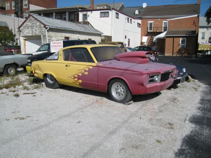 some red and yellow cars parked next to each other