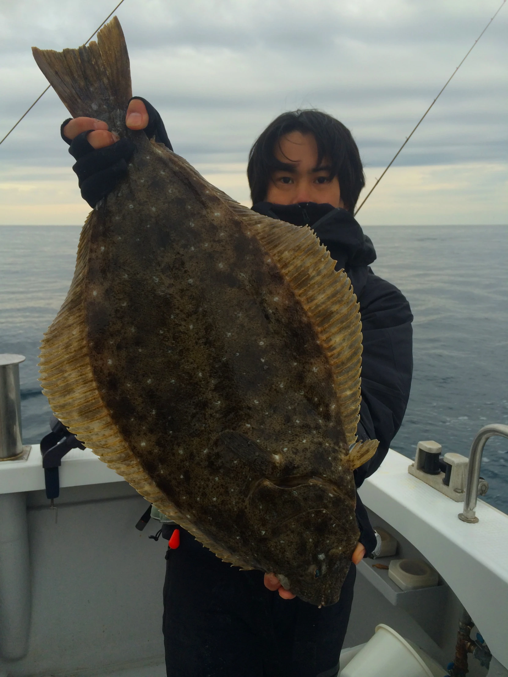 the girl holding a large fish in her hands