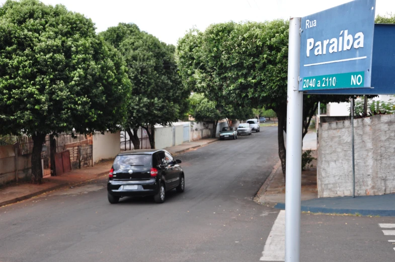 car stopped at side of street in residential area