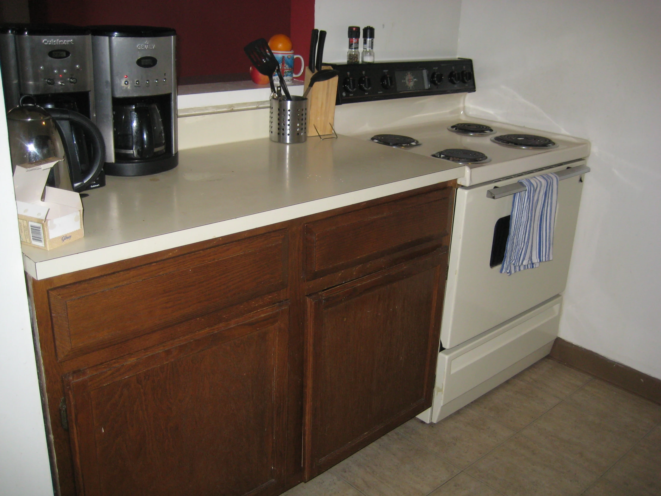 a kitchen with a coffee maker and electric oven