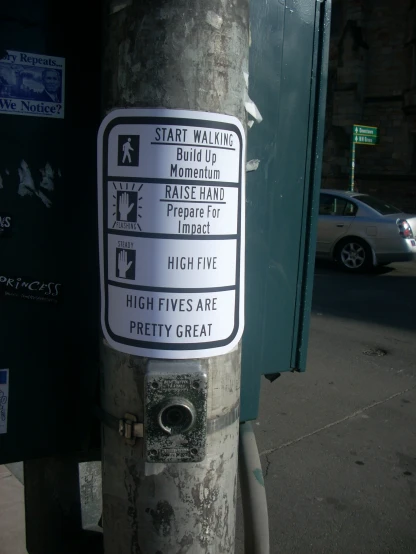 a sticker on a street pole telling which areas are high five