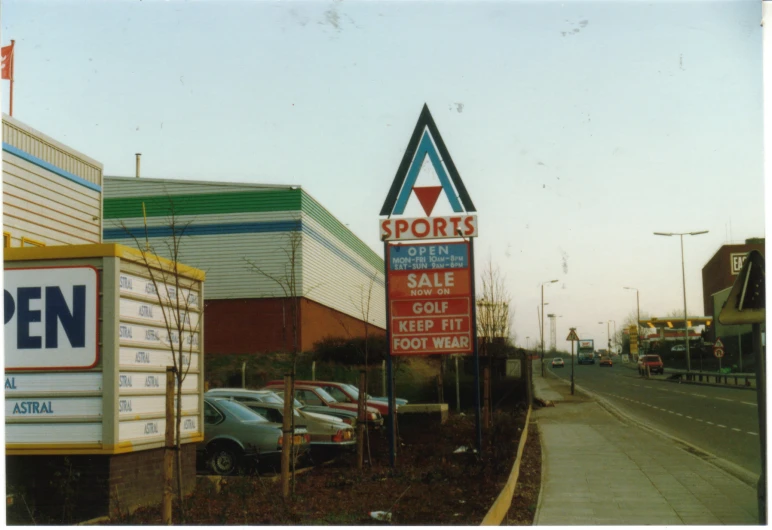 there is a sign on the side of the road advertising sports