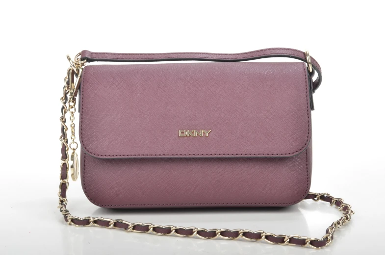 a purple purse on a white surface