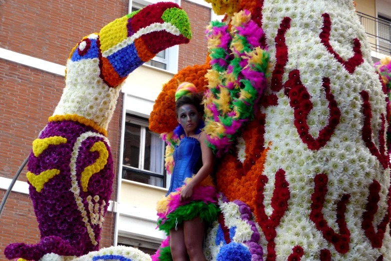 a woman standing in front of some very large sculptures