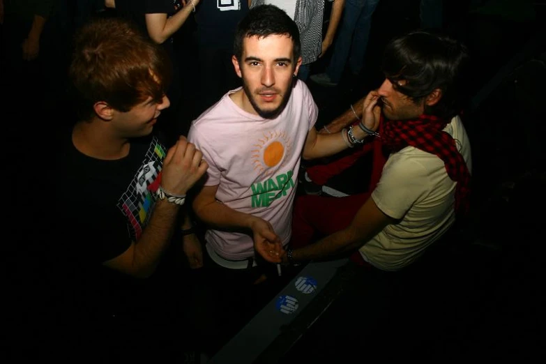 a man standing in front of a crowd with a knife