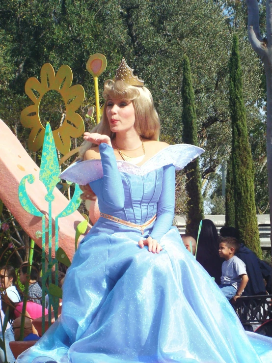 a lady is dressed up in a princess costume