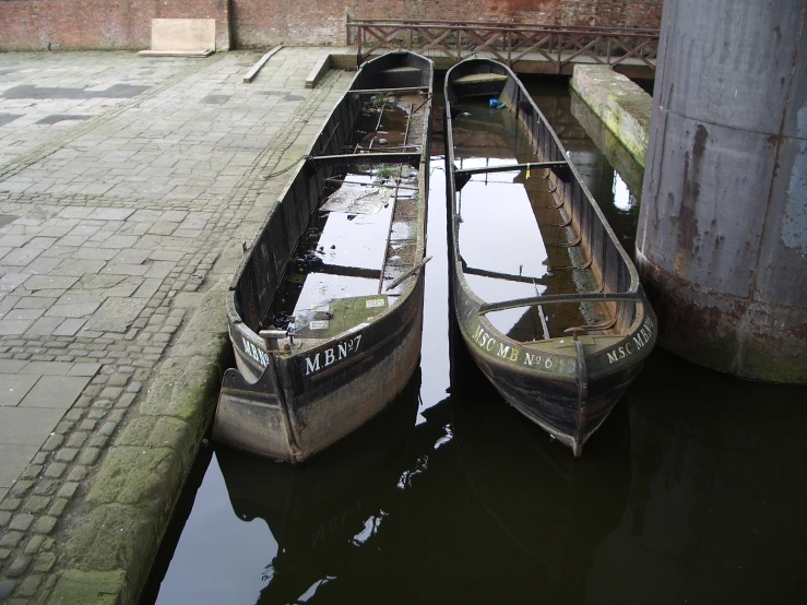 two boats that are sitting next to each other