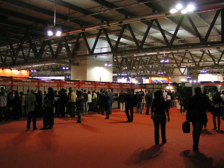 a number of people standing around a building