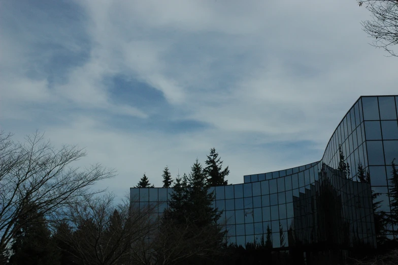 two glass and steel building under cloudy sky