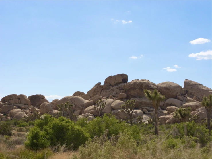 the big boulders are sitting alone by the desert