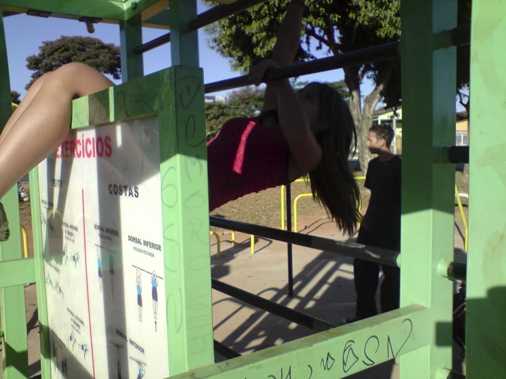 a person doing a hand stand on a playground