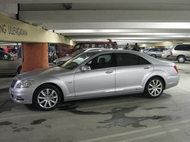 a parked car in a parking garage in front of parking spaces