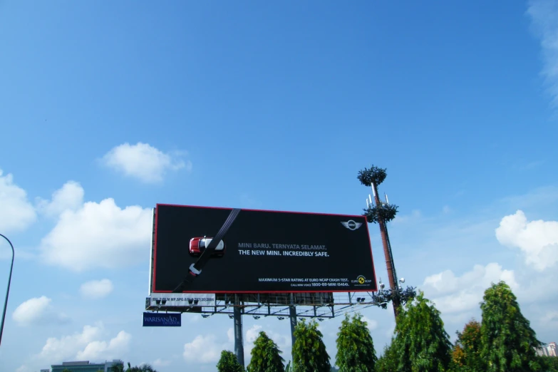 a billboard with an ad behind it