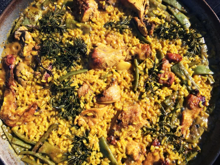 a big bowl with food inside that is sitting on a table