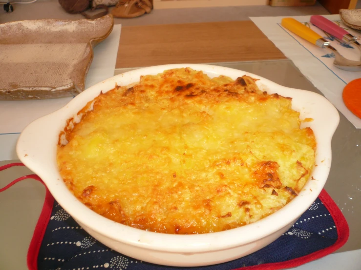 the casserole dish is full of cheese and ready to be served